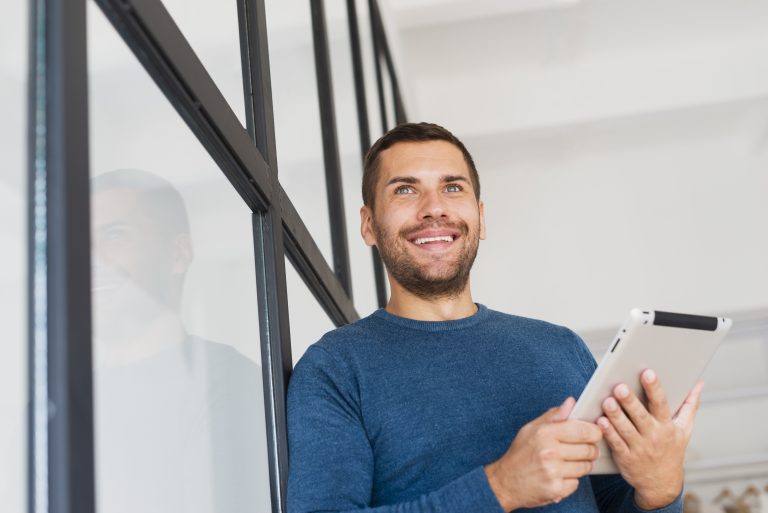 low-angle-man-with-tablet-home