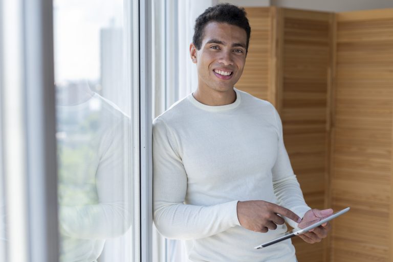 man-holding-tablet-facing-camera